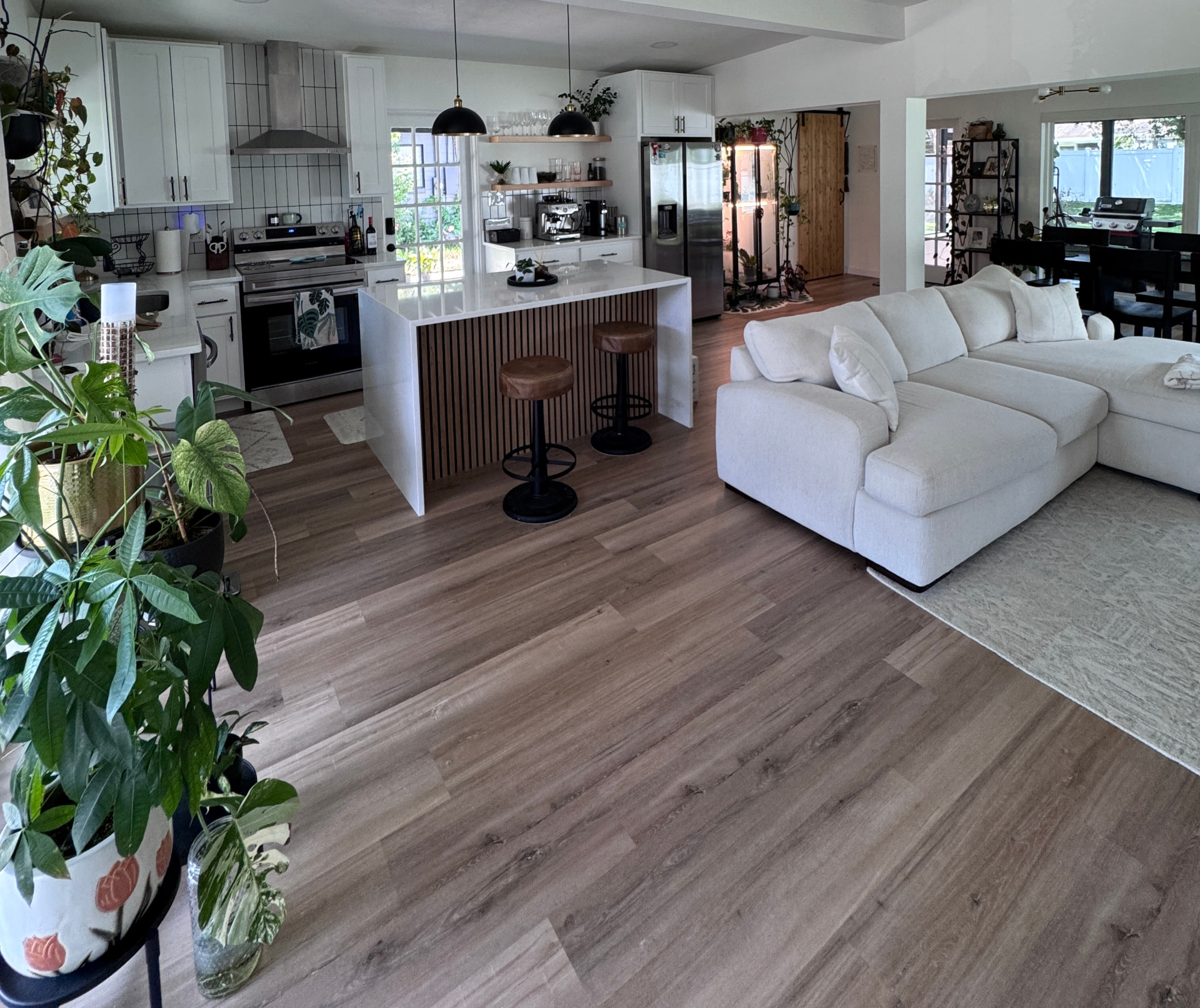 Bright open concept kitchen and living room in Tim MacDonald's Orlando home where he films UGC content
