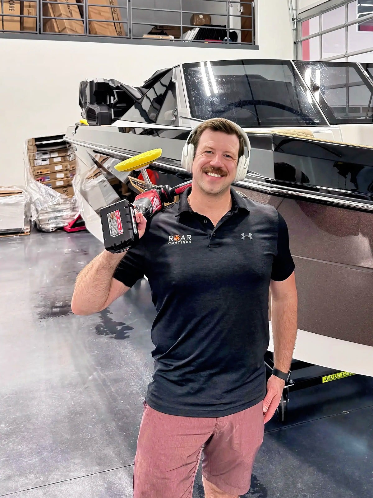 Tim MacDonald, automotive UGC creator, in his shop